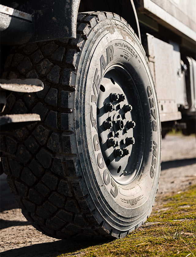 Close-up of rugged offroad tire on overland adventure van, perfect for vanlife and expedition travel