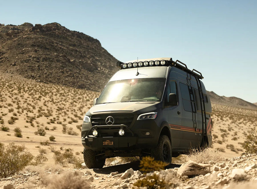 Overlanding 4x4 van conquering desert terrain, equipped for adventure travel and vanlife