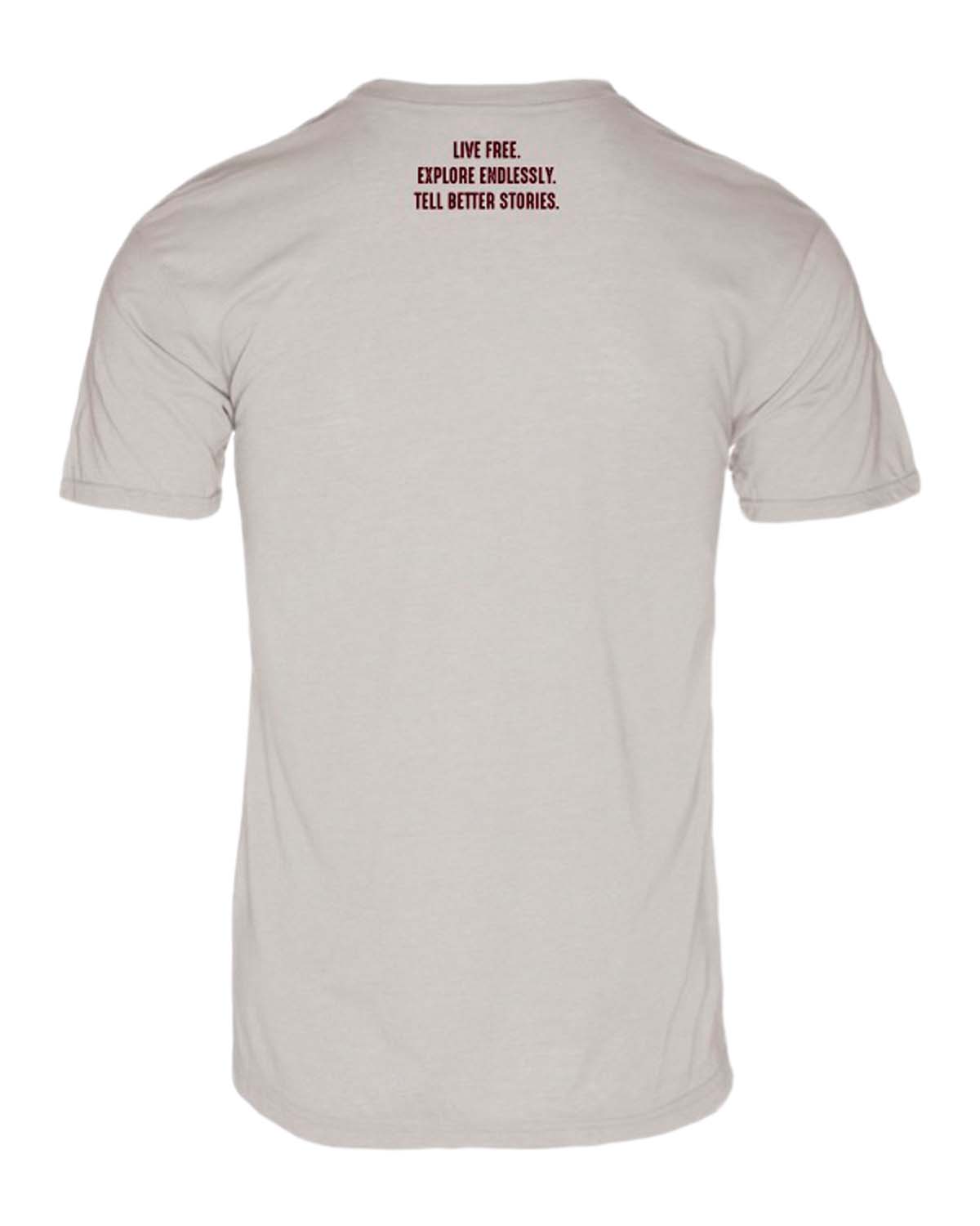 Beige adventure vanlife t-shirt back with 'Live Free. Explore Endlessly. Tell Better Stories.' text.